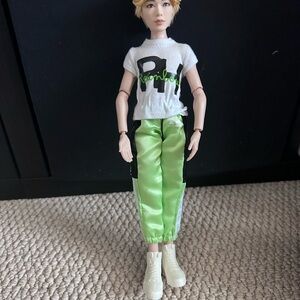 Stylish Doll with Graphic Tee and Green Pants
